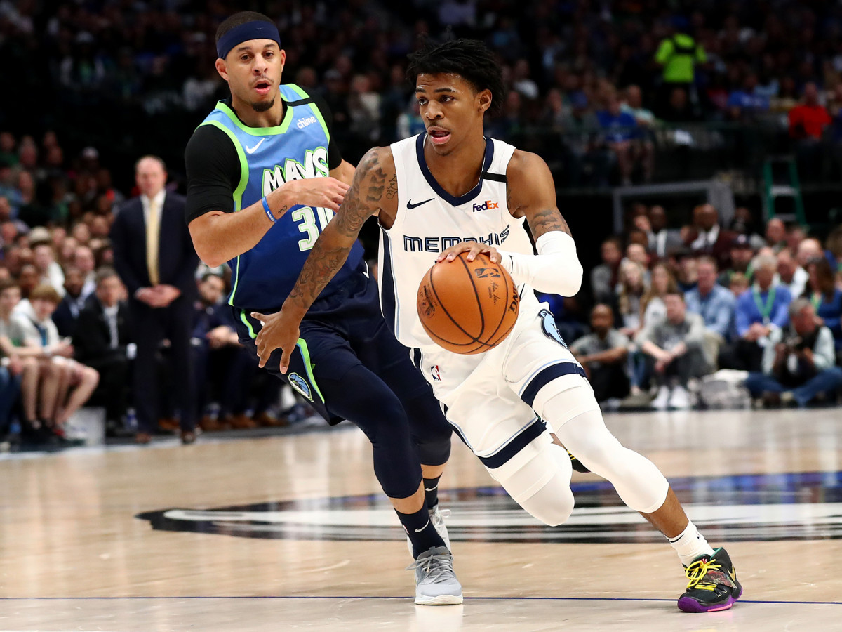 Mar 6, 2020; Dallas, Texas, USA; Memphis Grizzlies guard Ja Morant (12) drives in the second  quarter against Dallas Mavericks guard Seth Curry (30) at the American Airlines Center.